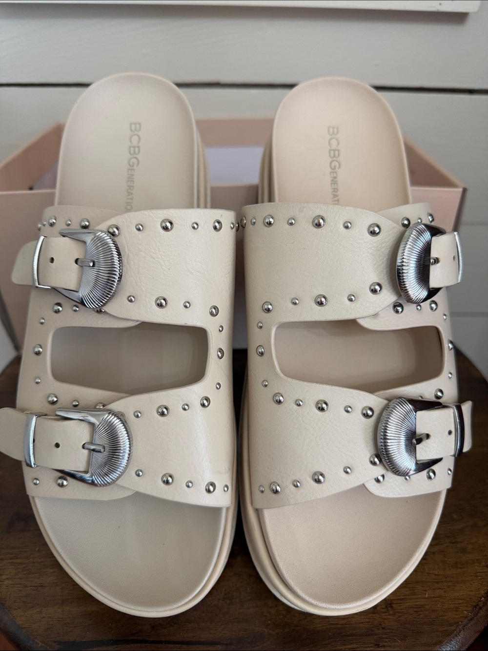 BCBGeneration Ivory Slide Sandals with Silver Buckles